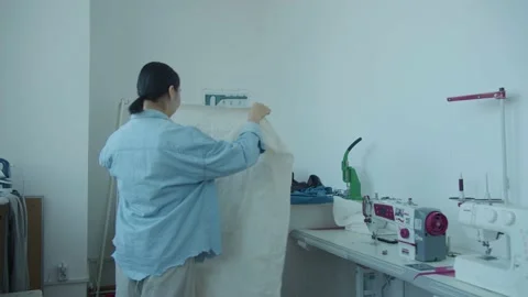 Girl in the sewing studio Stock Footage 234873939