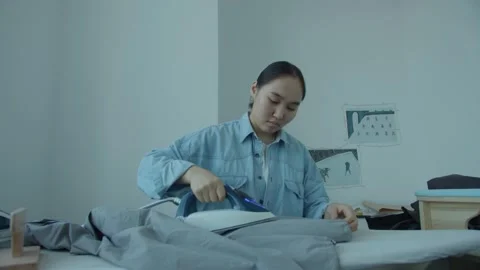 Girl in the sewing studio Stock Footage 234873958