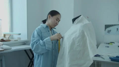 Girl in the sewing studio Stock Footage 234874203