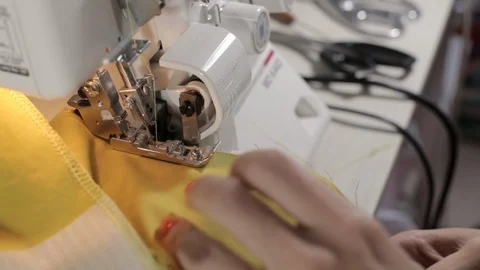 Girl sews on a sewing machine Stock Footage 119376953
