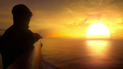 Girl on the ship looking at the sunset. Stock Footage 44565356