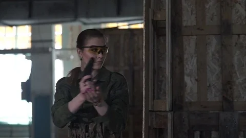 The girl shoots at the enemy Stock Footage 75333353