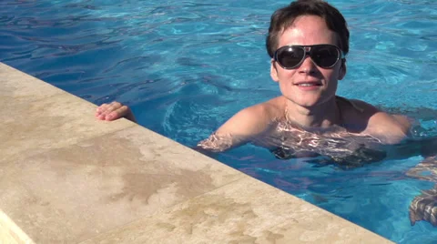 Girl at the side of the pool HD Stock Footage 25596029