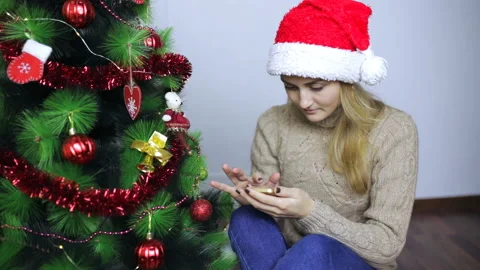 Girl sits and typing a message on your mobile phone Stock Footage 101323947