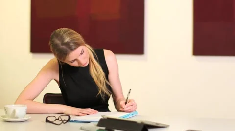 Girl sits and writes Stock Footage 42139287