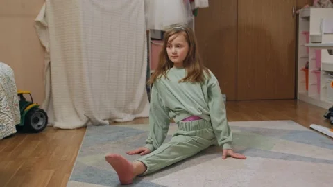 Girl Sits On The Leg Split Stock Footage 167756840