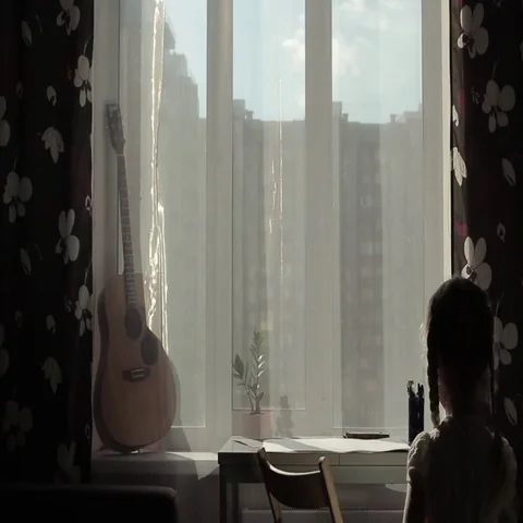 Girl sits at the table Stock Footage 69700378