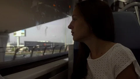 The girl sits in a train by the window Stock Footage 101072559