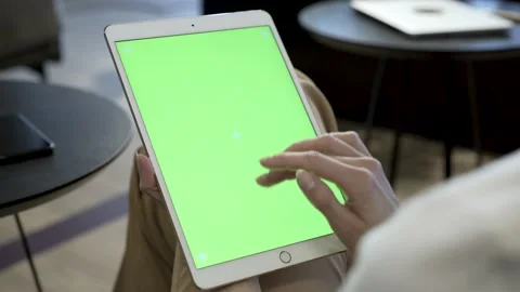 Girl sitting and holding iPad tablet Stock Video Pond5