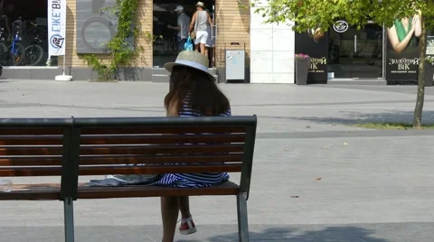 The girl sitting on the bench Stock Footage 65614069