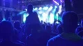 Girl sitting on boyfriend's shoulders shooting favourite music band performance HD Footage