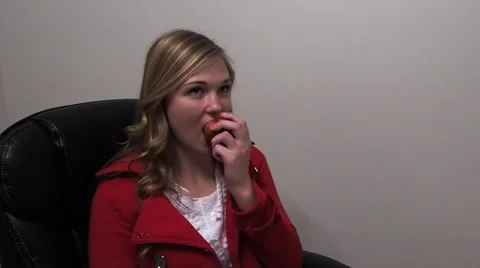 Girl sitting down with apple Stock Footage 46763333