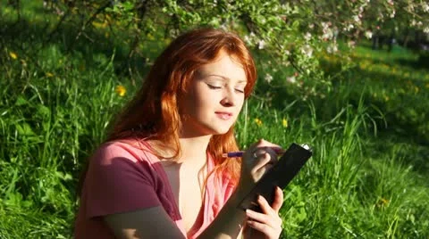 Girl sitting on the grass Stock Footage 11017294