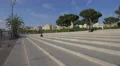 Girl sitting on the outside stairs in Barcelona 4k or 4k+ Resolution