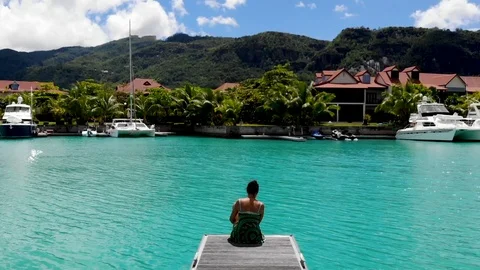 The girl is sitting on the pier. Stock Footage 101976513