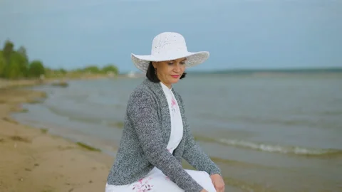 A girl is sitting by the river Stock Footage 160959886