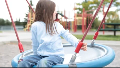 Girl sitting on a swing Video stock 5504489