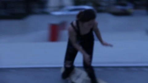 Girl at skateboard gets close to camera Stock Footage 109112324