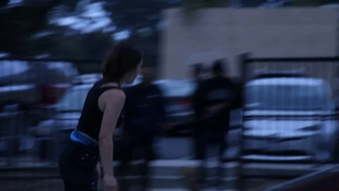 Girl skates in a loop at park Stock Footage 109112494