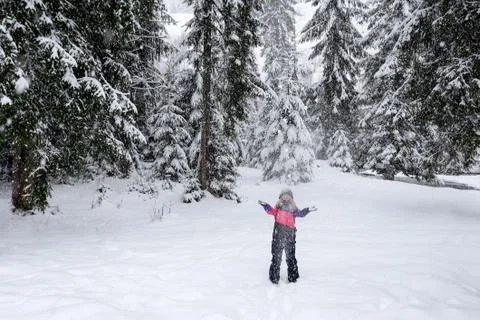 Girl ski suit throwing snow in the air Stock Photos