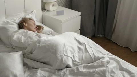 Girl is sleeping on the bed Stock Footage 88165372