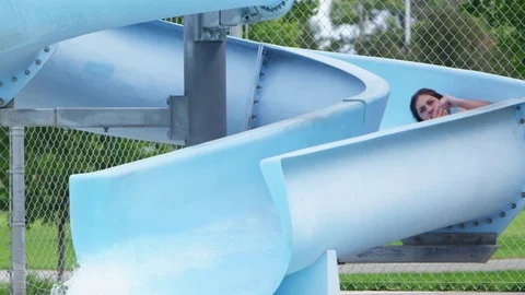 Girl sliding into the pool Video stock 80134345