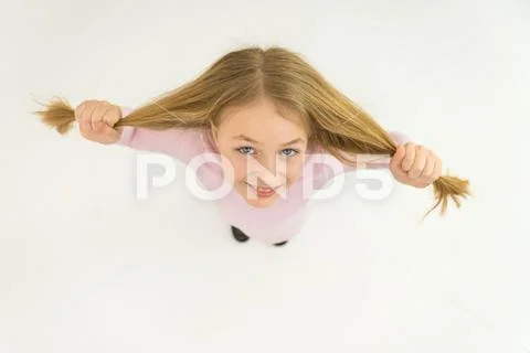 The girl smile to the camera. View from above Stock Photos