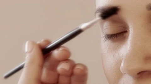 Girl, smile, studio makeup with stylish brush, slow motion, 4K, UHD, UltraHD Video stock 68856437