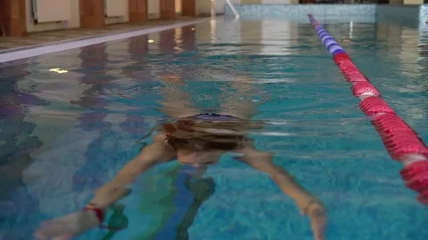 The girl is smiling by the poolside 스톡 동영상 75688446