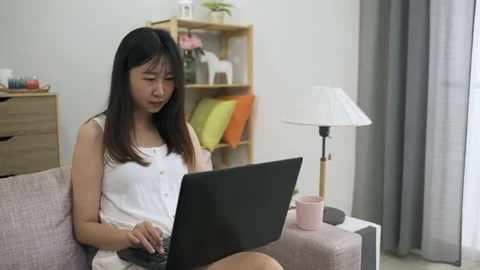 Girl smiling while enjoying using messaging app Video stock 156921746