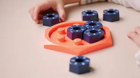 Girl solving logic puzzle, Children hands playing with educational math STE.. Stock Footage 327741664