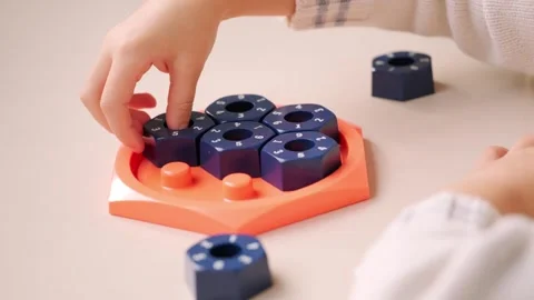 Girl solving logic puzzle, Children hands playing with educational math STE.. Stock Footage 330423656