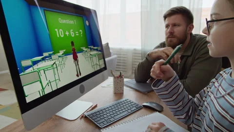 Girl Solving Math Exercise in Computer Game while Studying with Father Stock Footage 332782189