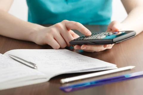 Girl solving a math problem Stock Photos