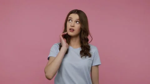 Girl solving serious problem in mind, thinks over smart idea Stock Footage 157743214