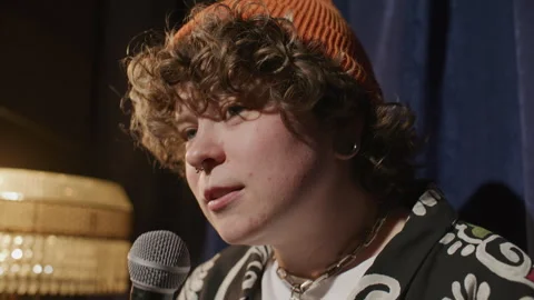 Girl Speaking into Microphone during Stand Up Performance on Stage Stock Footage 333227792