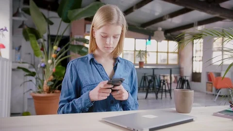 Girl spending time using mobile phone listening music and browsing in internet Stock Footage 103286555