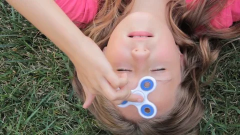 Girl with a spinner Stock Footage 80446682