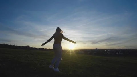 Girl spinning at sunset Stock Footage 246816860