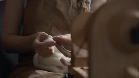 Girl Spinning Wool While Seated Stock Footage 255523498