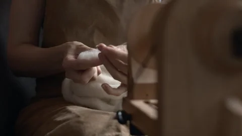 Girl Spinning Wool While Seated Stock Footage 255523543
