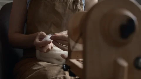 Girl Spinning Wool While Seated Stock Footage 255523565