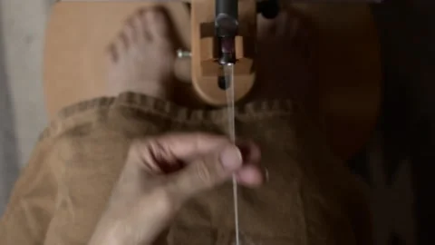 Girl Spinning Wool While Seated Stock Footage 255524219