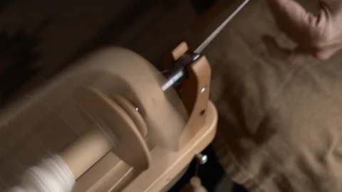 Girl Spinning Wool While Seated Stock Footage 255524293
