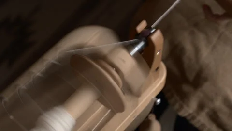 Girl Spinning Wool While Seated Stock Footage 255524434