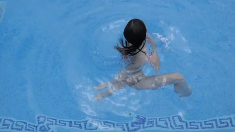 The girl spins in the pool Stock Footage 101630943