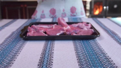 The girl spread the meat on a baking sheet Video stock 81232682