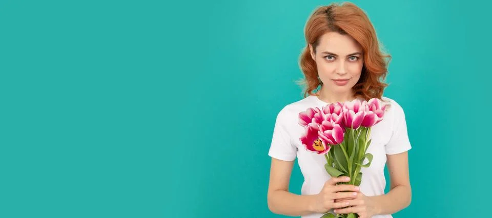 Girl with spring tulips flowers. woman with fresh tulip flower bouquet on blue Stock Photos