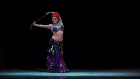 A girl on stage dancing belly dance in oriental dress Stock Footage 80762253