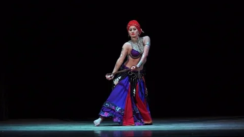 A girl on stage dancing belly dance in oriental dress Stock Footage 80762457